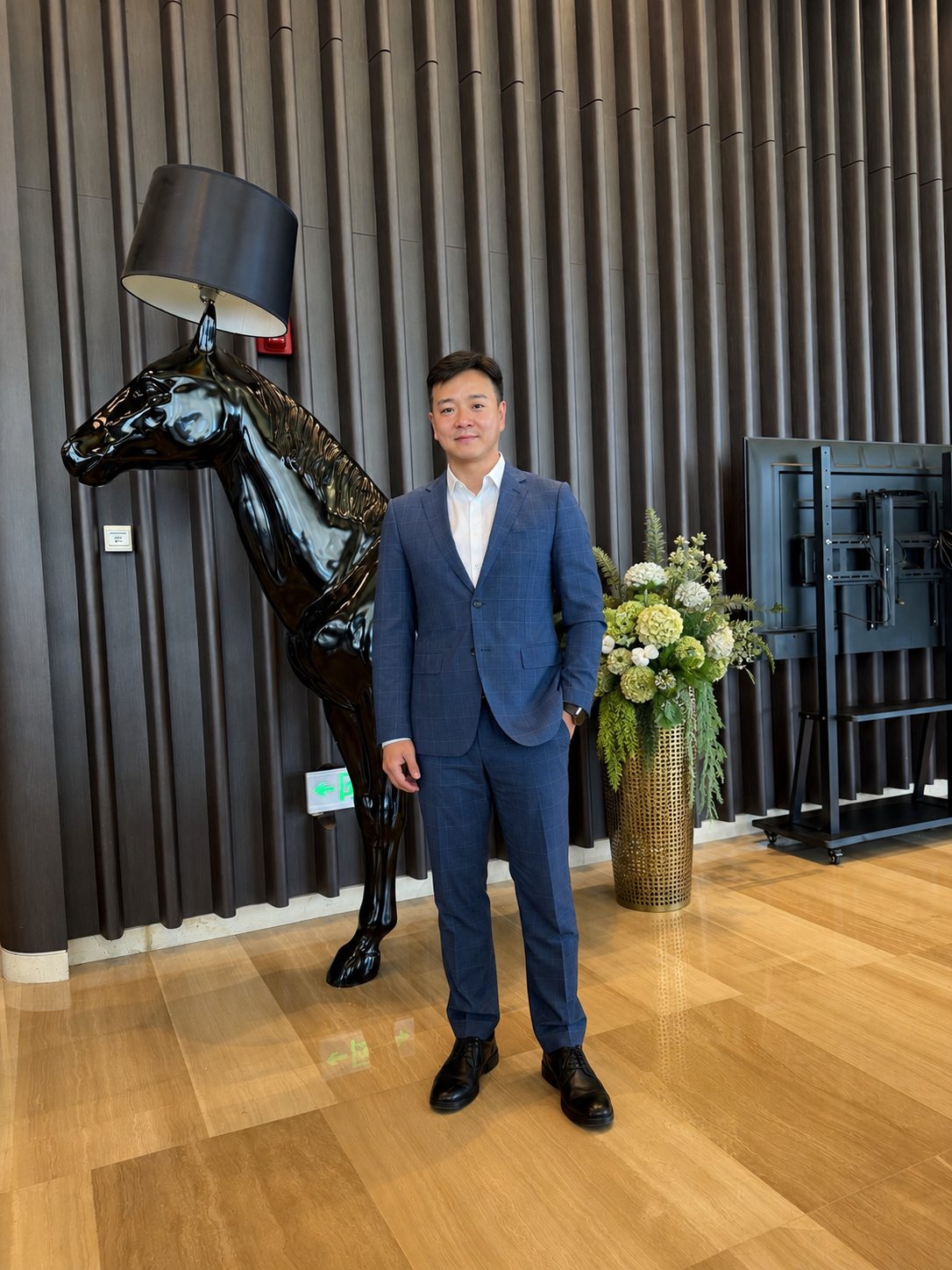 Founder of VELAN Global in a professional business setting